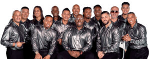 A group of men in silver shirts and black pants.